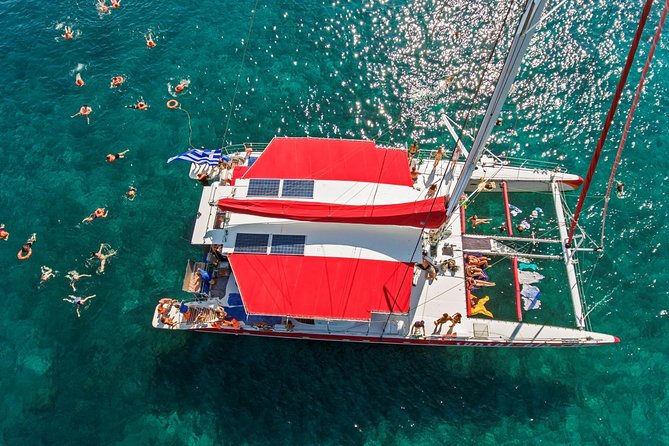 Sailing Catamaran Cruise in Santorini with BBQ, Drinks and Transfer - Pickup From Your Hotel and the Port Departure