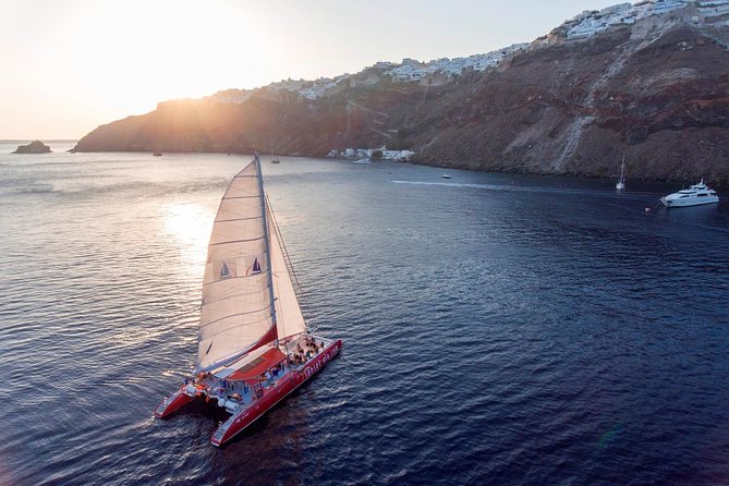 Sailing Catamaran Cruise in Santorini with BBQ, Drinks and Transfer - What the Catamaran Is Like On Board
