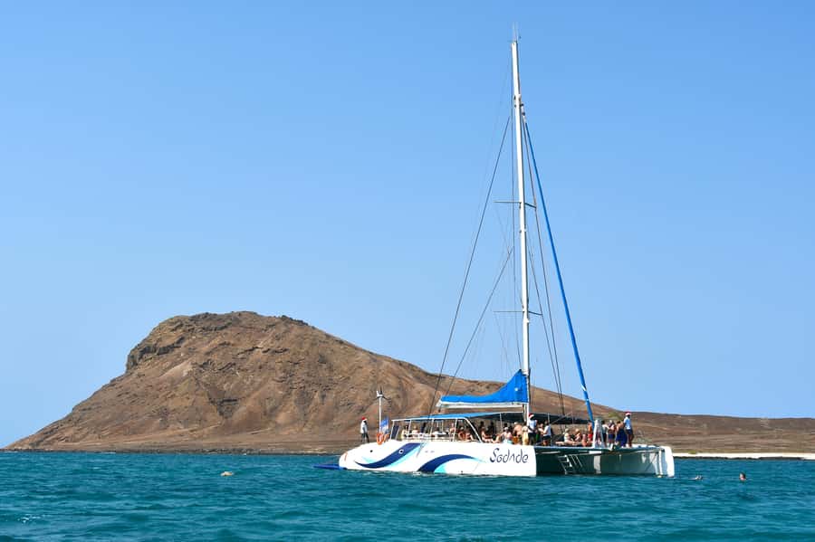 Sal: All-Inclusive Half-Day Lounge Catamaran Cruise - The mid-cruise swim stop near the rocky shore