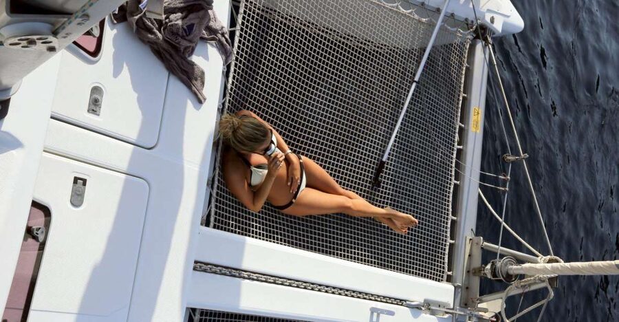 Santorini: 7-Hour Private Catamaran Cruise with Food & Drink - Red Beach and White Beach show Santorini’s volcanic side