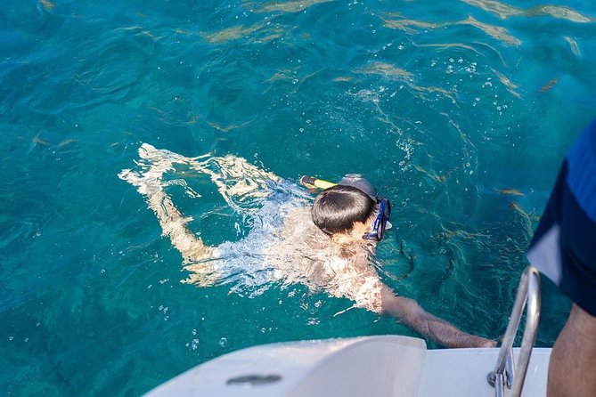 Santorini Adventurous Catamaran Experience with Snorkeling - Akrotiri Lighthouse and the southern coast