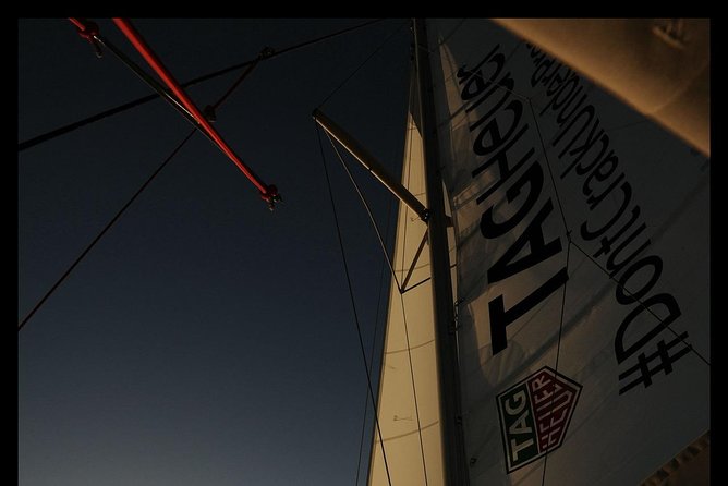 Santorini Adventurous Catamaran Experience with Snorkeling - Lunch, dinner, wine, and the social side