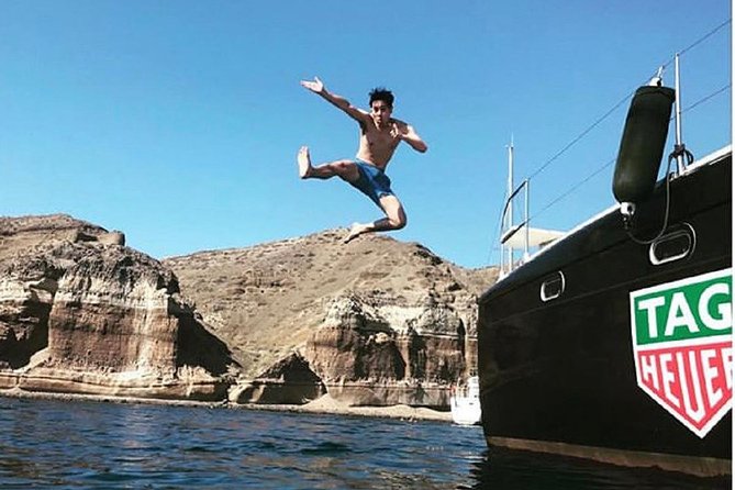 Santorini: Adventurous Catamaran Experience with Snorkeling - From Fira to Vlychada by minibus