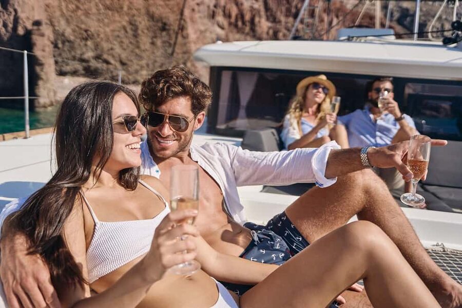 Santorini: Caldera Luxury Catamaran Cruise w/ Meal & Drinks - Red Beach: scarlet cliffs and the first swim