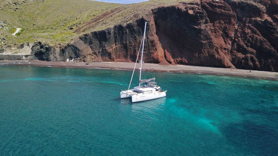Santorini: Caldera Luxury Catamaran Cruise w/ Meal & Drinks - Nea Kameni: black lava and sulfur water