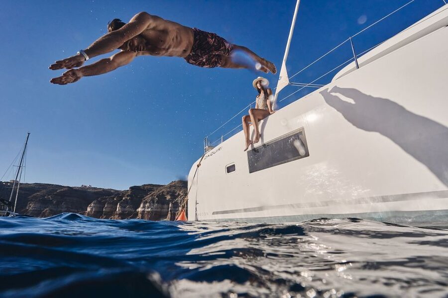 Santorini: Caldera Luxury Catamaran Cruise w/ Meal & Drinks - Hotel pickup from Oia, Fira, and the south coast