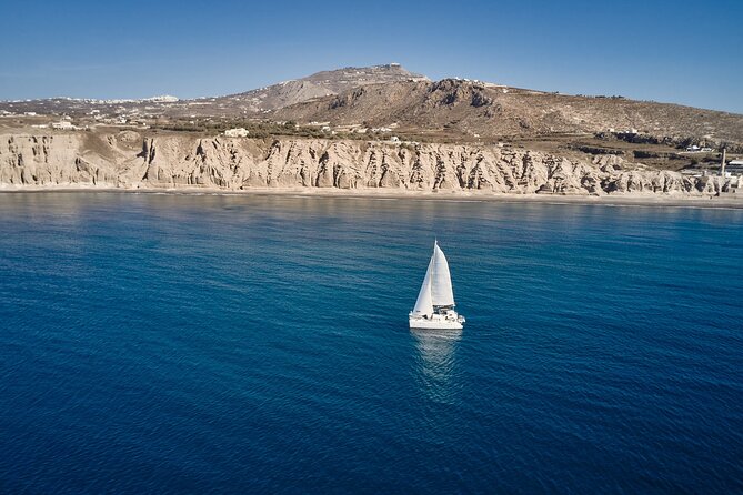 Santorini: Caldera Private Catamaran Cruise with Meal & Drinks - Red Beach: Santorini’s most dramatic shore