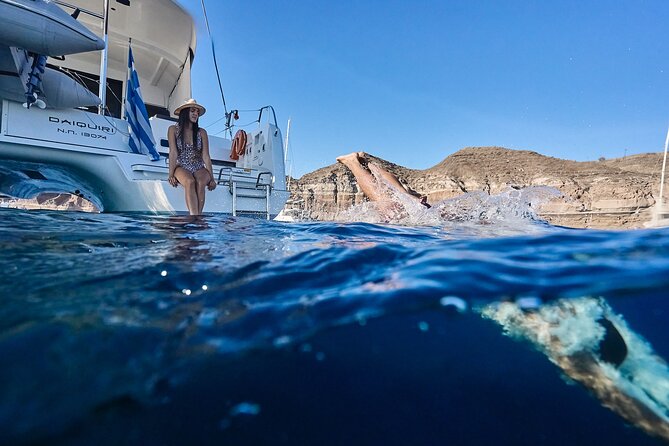Santorini: Caldera Private Catamaran Cruise with Meal & Drinks - Daytime or sunset: choose the mood carefully