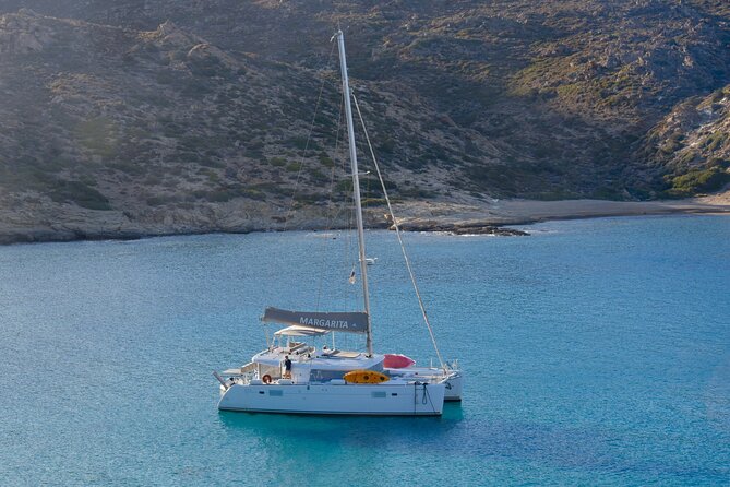 Santorini: Caldera Private Catamaran Cruise with Meal & Drinks - White Beach and the changing volcanic colors