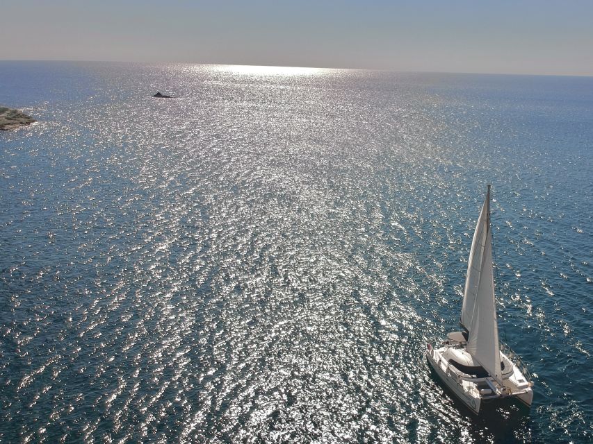 Santorini: Catamaran Cruise with Food and Drinks - White Beach and the southern coast