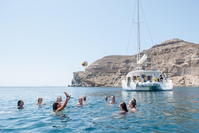Santorini Catamaran Cruise with Fresh Meal and Open Bar - The Akrotiri lighthouse, Indian Rock, and Black Mountain