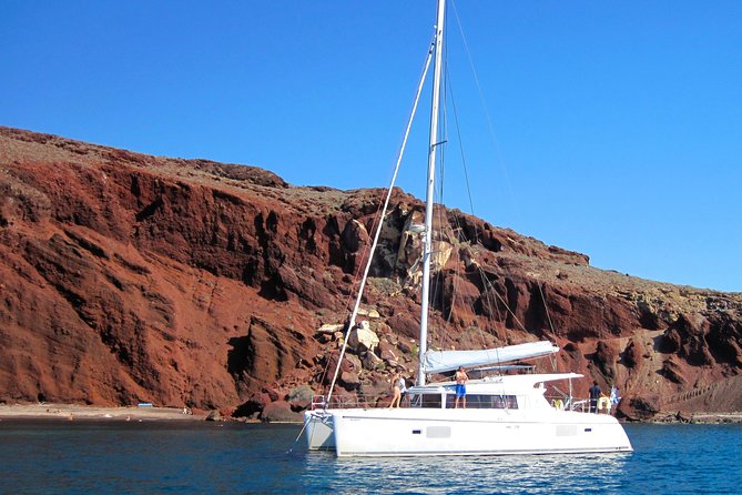 Santorini Catamaran Cruise with Fresh Meal and Open Bar - Lunch on deck with seafood and grilled meats