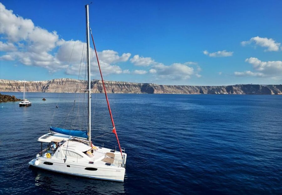 Santorini: Catamaran Cruise with Greek BBQ and Drinks - Vlychada Marina and the first welcome aboard