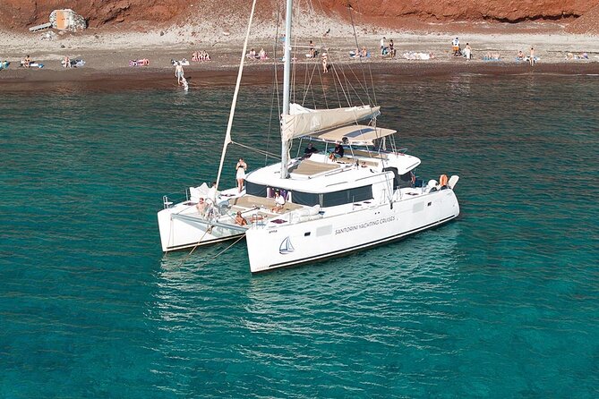 Santorini Catamaran Cruise: with Lunch, BBQ, Open Bar, Transfers - From your hotel to Vlychada Marina at 10:00am