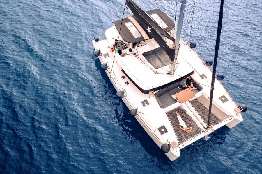 Santorini: Catamaran Cruise with Lunch, Drinks, & Oia Visit - Thirassia brings the first real swim