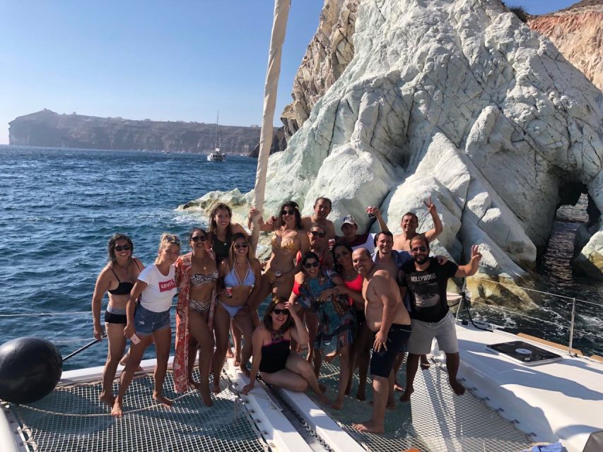 Santorini: Catamaran Cruise with Meal & Open Bar - The sunset from the water