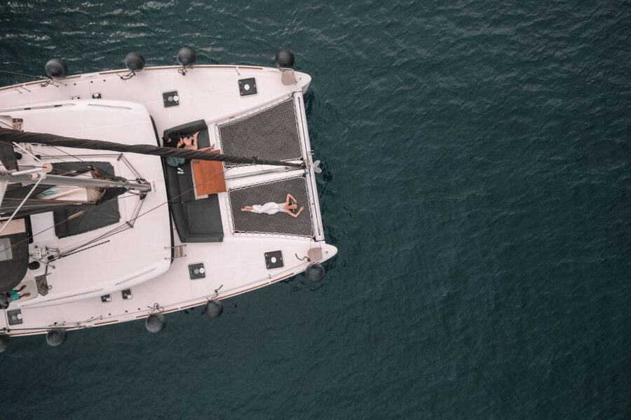 Santorini Catamaran Cruise with Swimming, Meal and Open Bar - White Beach and the Akrotiri Lighthouse
