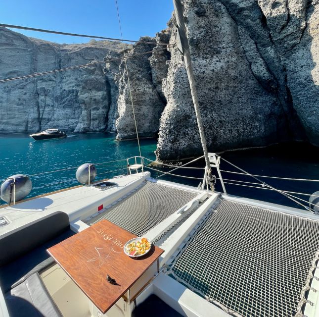 Santorini Catamaran Cruise with Swimming, Meal and Open Bar - Indian Rock, Black Mountain, and the return sail