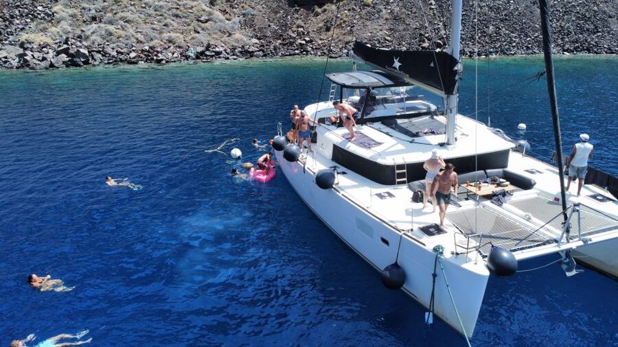 Santorini Catamaran Cruise with Swimming, Meal and Open Bar - Leaving Vlychada for Red Beach