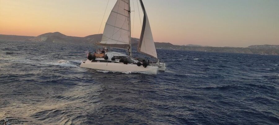 Santorini:Catamaran: private cruise with food & drinks - Red Beach and the first swim