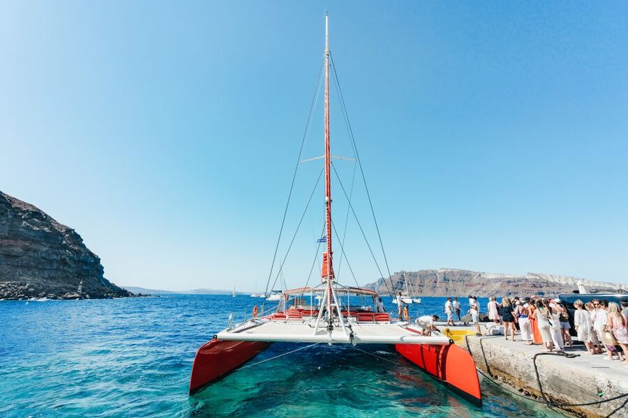 Santorini: Catamaran Tour with BBQ Dinner, Drinks, and Music - Hot springs and the first swim