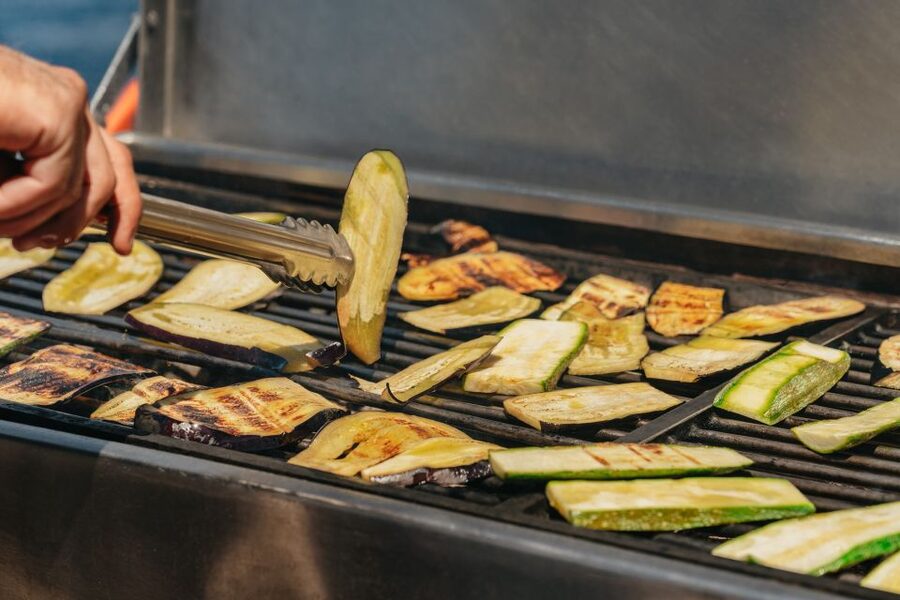 Santorini: Catamaran Tour with BBQ Dinner, Drinks, and Music - A barbecue with Greek flavors