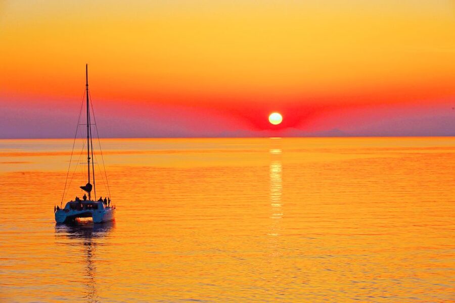 Santorini: Catamaran Tour with BBQ Meal and Unlimited Drinks - Red Beach and snorkeling time