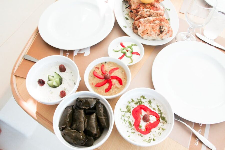 Santorini: Catamaran Tour with BBQ Meal and Unlimited Drinks - The sunset option below Oia