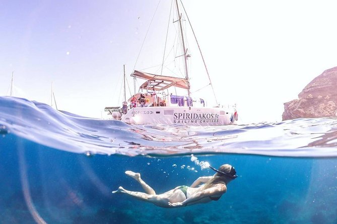 Santorini Classic Catamaran Cruise with BBQ, Drinks and Transfers - Daytime sailing or sunset cruise
