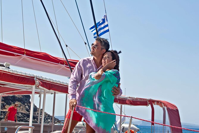 Santorini Cruise on Catamaran with BBQ & Open Bar - Open bar, deck space, and practical comfort