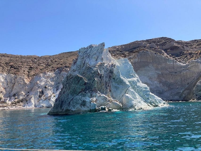 Santorini:Cruises with Catamaran around the Volcanic Island. - White Beach shows a quieter side of the coast