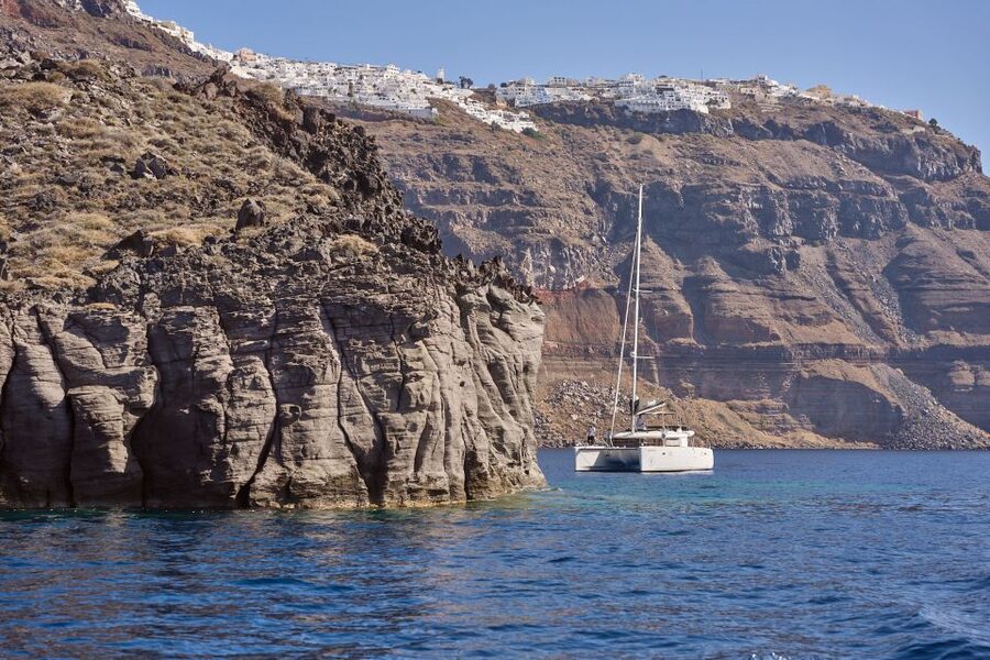Santorini: Day Luxury Catamaran Cruise with Meal & Drinks - The return route passes Fira’s Old Harbor