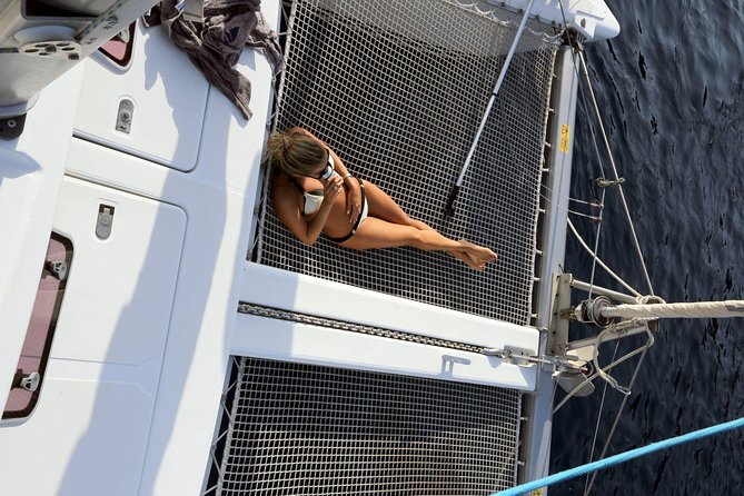 Santorini Full Day Catamaran Private Cruise incl. Meal, Drinks & Free Transport - Red Beach and White Beach from the sea