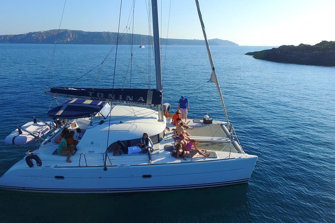 Santorini Full Day Catamaran Private Cruise incl. Meal, Drinks & Free Transport - Aspronisi and the volcanic layers of Thirassia