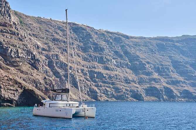 Santorini: Luxury Catamaran Cruise with Fresh Fish BBQ & Drinks - Starting Near Imerovigli and Reaching the Pier
