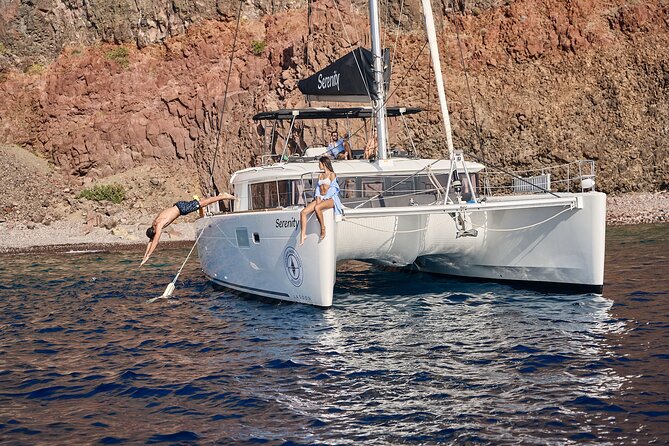 Santorini: Luxury Catamaran Cruise with Fresh Fish BBQ & Drinks - Fresh Fish, Greek Salad, and an Easygoing Meal