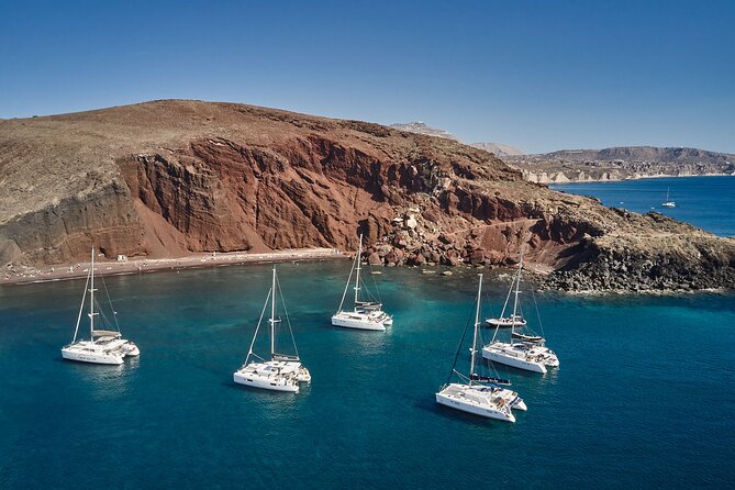 Santorini: Luxury Catamaran Cruise with Fresh Fish BBQ & Drinks - Red Beach: Santorini’s Most Striking Shoreline