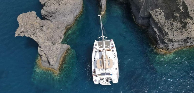 Santorini: Luxury Catamaran Cruise with Lunch, BBQ & Drinks - Entering the Caldera and reaching the volcano hot springs