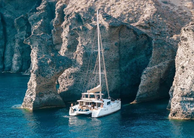 Santorini: Luxury Catamaran Cruise with Lunch, BBQ & Drinks - Red Beach and the volcanic south coast
