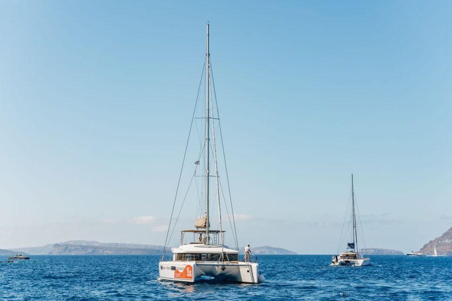 Santorini: Luxury Catamaran Day Trip with Meal and Open Bar - Red Beach and the first swim