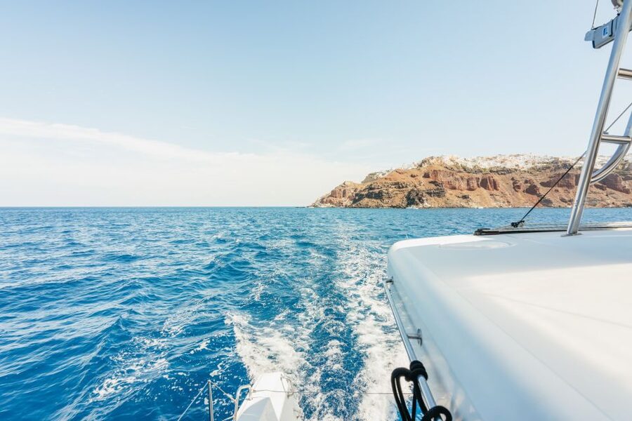 Santorini: Luxury Catamaran Day Trip with Meal and Open Bar - White Beach sea caves and snorkeling