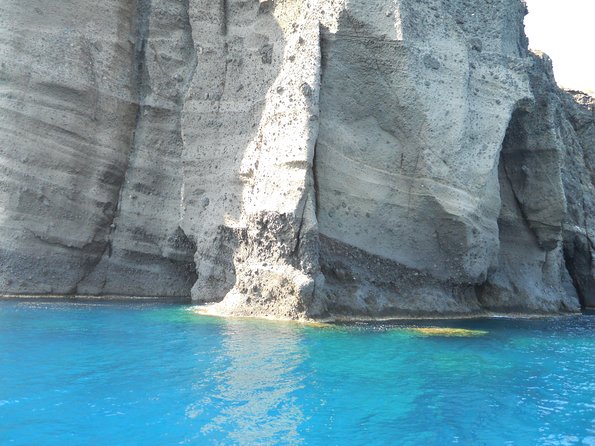 Santorini Luxury Catamaran Sunset Cruise with BBQ, Drink and Transfer - White Beach, barbecue, and more time in the water