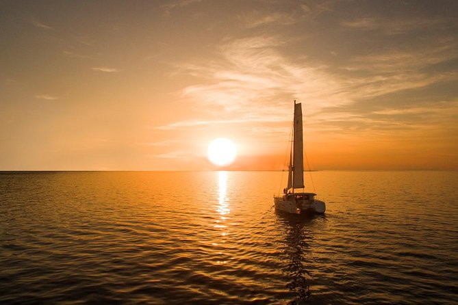 Santorini Luxury Catamaran Sunset Cruise with BBQ, Drink and Transfer - Sunset on the water