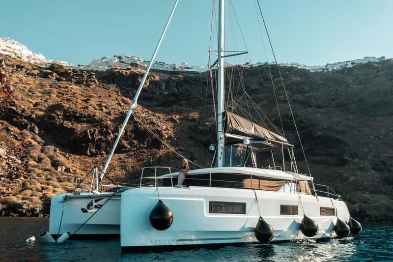Santorini: Majestic Catamaran Cruise with Meal and Drinks - Volcanic shores and the hot springs