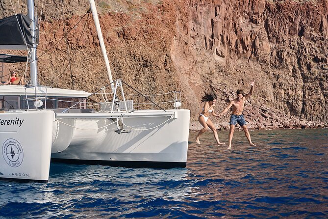 Santorini Oia: Private Sunset Catamaran Cruise with BBQ & Drinks - White Beach and Red Beach bring the strongest colors