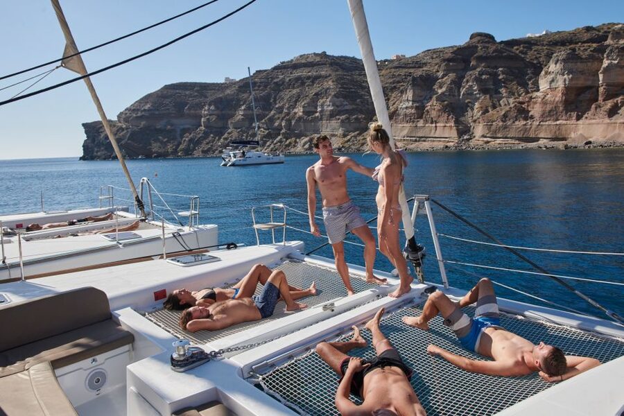 Santorini: Platinum Catamaran Cruise w/ BBQ Meal & Open Bar - Thirasia is the main meal and swim stop