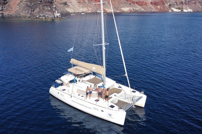 Santorini Platinum Catamaran Cruise with Meal, BBQ and Open Bar - The Akrotiri lighthouse and the volcanic hot springs
