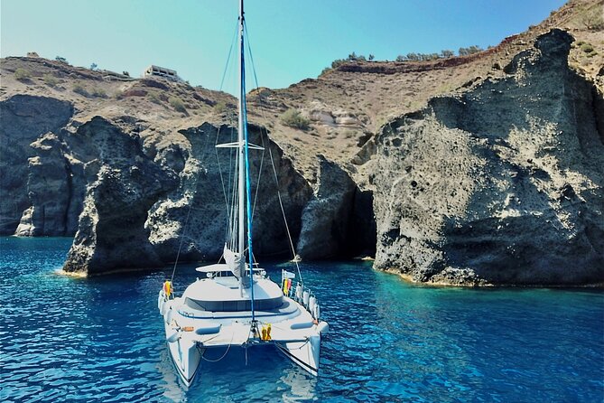 Santorini: Premium Small-Group Catamaran Cruise with Food/Drinks - Red Beach brings the first swim