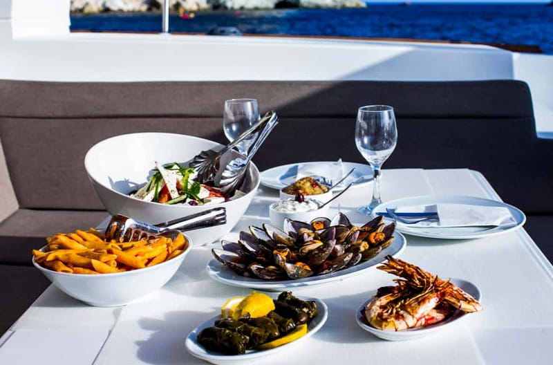Santorini: Private Catamaran Cruise with BBQ Meal and Drinks - The view toward Fira Old Port