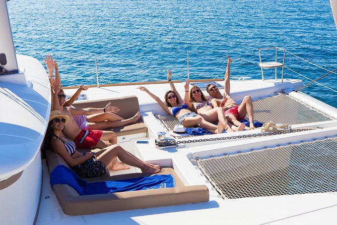 Santorini Private Catamaran Cruise with BBQ, Open Bar & Transfers - Palea Kameni offers a volcanic swim, not a hot tub